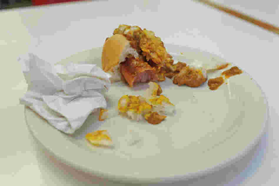 There are several key ingredients that define a Detroit Coney: A steamed bun, a natural-casing hot dog (usually a blend of beef and pork), a beanless chili topping, chopped onions and mustard. Forks are optional. Napkins? Mandatory.
