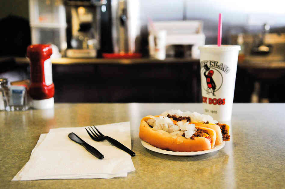 A view of the counter at the Coney Island Lunch in Kalamazoo, founded in 1915 by Greek immigrant Gus Marinos. When eating a Coney, don't grab for that ketchup — "you could get thrown out for that," warns Joe Grimm. 