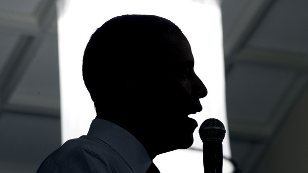 President Obama rips into his all-but-certain GOP foe, Mitt Romney, during a stop Monday at the Cincinnati Music Hall. Obama said Romney's tax plans would create 800,000 jobs — overseas.