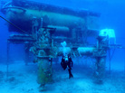 A diver swims by the Aquarius Reef Base, a permanent working undersea laboratory off Key Largo, Fla., in the Florida Keys National Marine Sanctuary. The Obama administration cut the lab's funding, and now scientists are trying to save it. A diver swims by the Aquarius Reef Base, a permanent working undersea laboratory off Key Largo, Fla., in the Florida Keys National Marine Sanctuary. The Obama administration cut the lab's funding, and now scientists are trying to save it.
