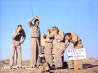 Five Air Force officers stand at ground zero of an atomic bomb test at a Nevada test site on July 19, 1957. Five Air Force officers stand at ground zero of an atomic bomb test at a Nevada test site on July 19, 1957.