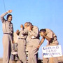 Five Air Force officers stand at ground zero of an atomic bomb test at a Nevada test site on July 19, 1957. Five Air Force officers stand at ground zero of an atomic bomb test at a Nevada test site on July 19, 1957.