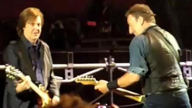 Paul McCartney, left, and Bruce Springsteen during Saturday's show in Hyde Park — before the plug was pulled. Frame grab from video posted by "BenR753" on YouTube.