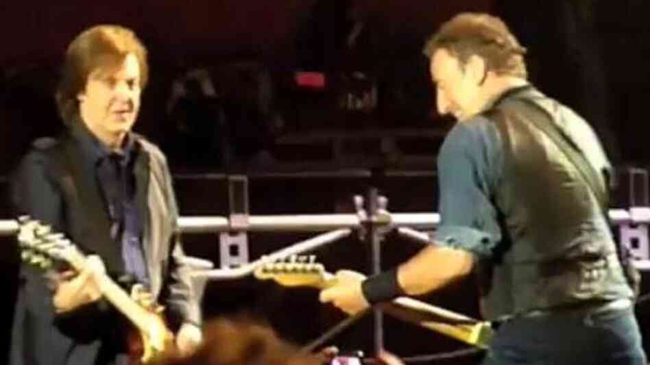 Paul McCartney, left, and Bruce Springsteen during Saturday's show in Hyde Park — before the plug was pulled. Frame grab from video posted by "BenR753" on YouTube.