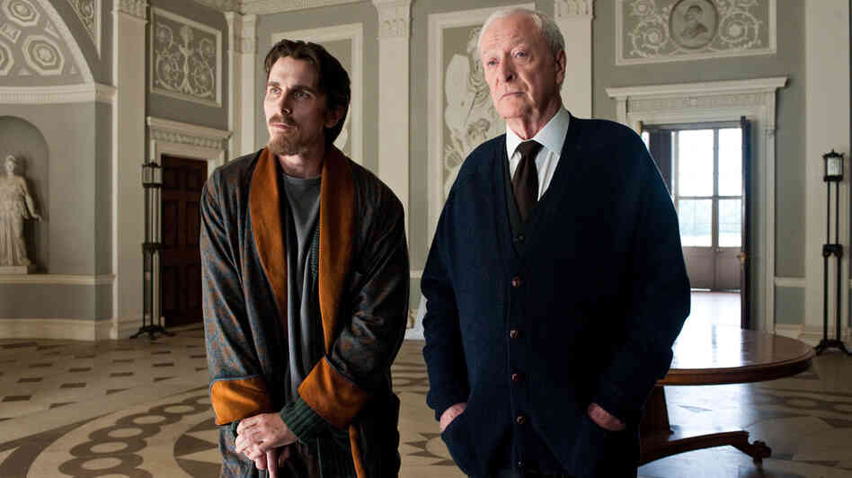 The Dark Knight Rises begins eight years after The Dark Knight, with Bruce Wayne (Christian Bale) living a reclusive life at his mansion alongside Alfred (Michael Caine). The movie is the finale of Christopher Nolan's Batman trilogy. The Dark Knight Rises begins eight years after The Dark Knight, with Bruce Wayne (Christian Bale) living a reclusive life at his mansion alongside Alfred (Michael Caine). The movie is the finale of Christopher Nolan's Batman trilogy.