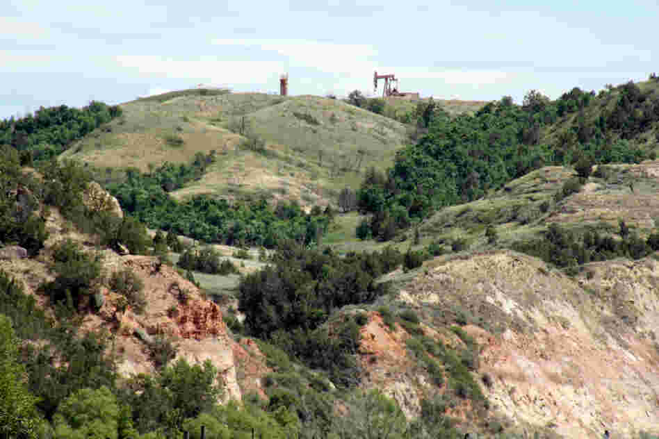 Oil wells have begun to appear on the ridges above the Little Missouri Valley.