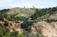 Oil wells have begun to appear on the ridges above the Little Missouri Valley.
