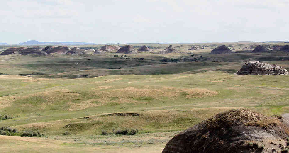 Rock formations stretch off in the distance, seen from Elkhorn Ranch.