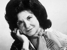 A studio portrait of Kitty Wells in the mid-'70s. A studio portrait of Kitty Wells in the mid-'70s.