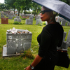 Queen Esther stands in front of Billie Holiday's gravesite in New York City. Queen Esther stands in front of Billie Holiday's gravesite in New York City.