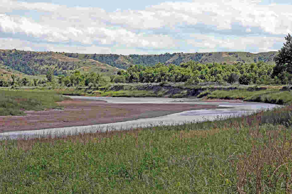 The Little Missouri River curves just in front of the Elkhorn Ranch site. The river flows north here to join the Missouri River.