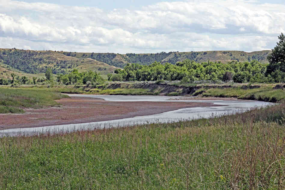 The Little Missouri River curves just in front of the Elkhorn Ranch site. The river flows north here to join the Missouri River.