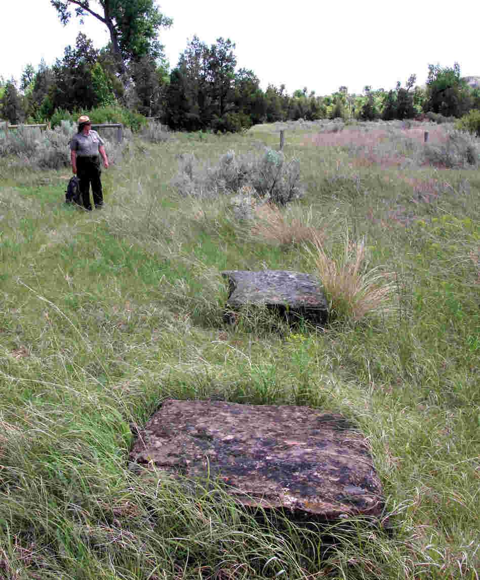 Park Superintendent Valerie Naylor points out the massive foundation stones for the ranch house.