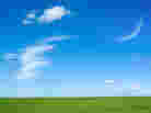 Crescent moon in a summer sky.