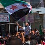Syria's ongoing fighting is increasingly a sectarian conflict with the majority Sunni Muslims facing off against the Alawites who make up most of the country's ruling elite. Here, government opponents rally in the northern town of Mareh on June 29.