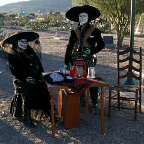 A couple celebrates Dia de los Muertos at the Concordia Cemetery.