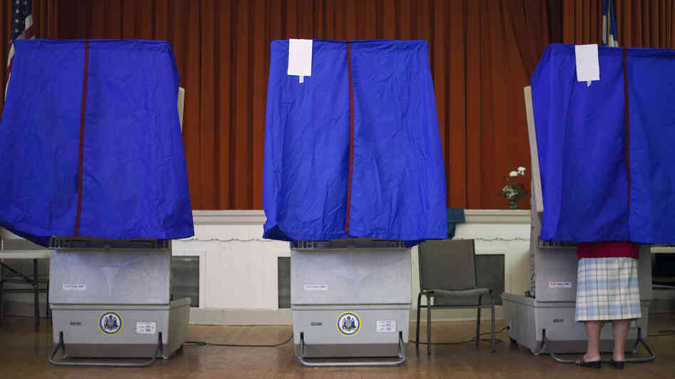 A voter casts a ballot during the Republican primary election April 24 in Philadelphia.