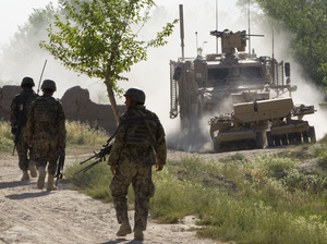 Afghan soldiers walk toward a U.S. Army mine-sweeping vehicle in southern Afghanistan on June 10. Roadside bombs remain a major threat to U.S. and Afghan troops, as well as civilians. Afghan soldiers walk toward a U.S. Army mine-sweeping vehicle in southern Afghanistan on June 10. Roadside bombs remain a major threat to U.S. and Afghan troops, as well as civilians.