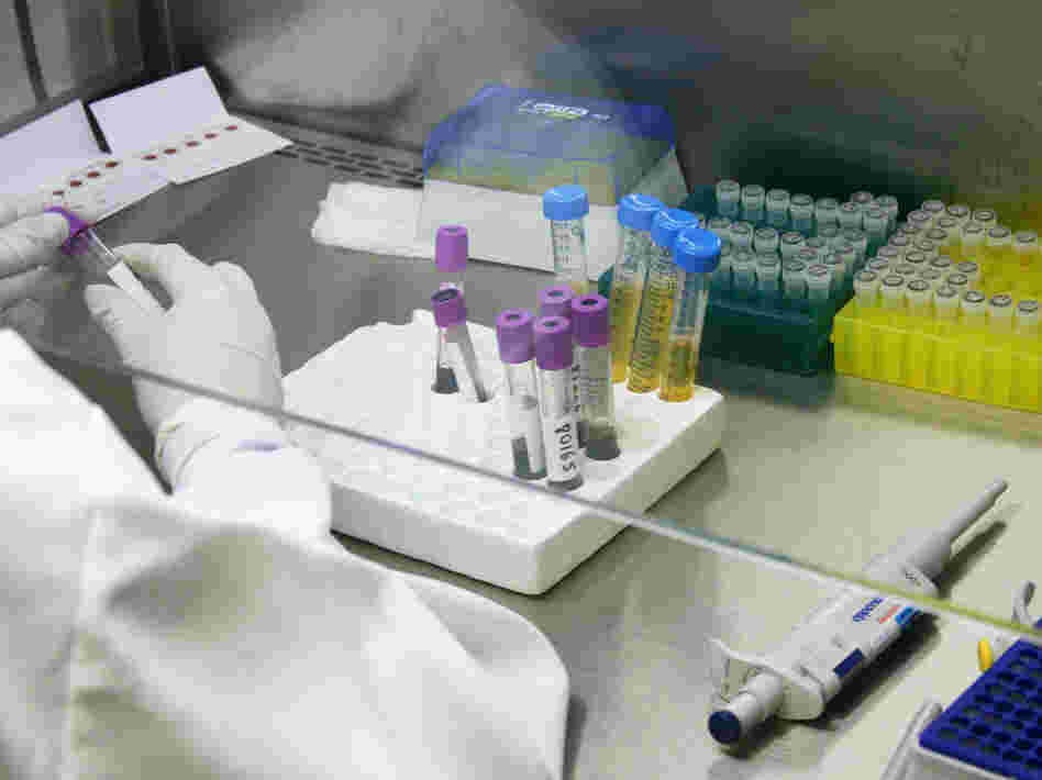 Researchers with HIV medication at a public research lab at the Oswaldo Cruz Foundation, or Fiocruz, in Rio de Janeiro.