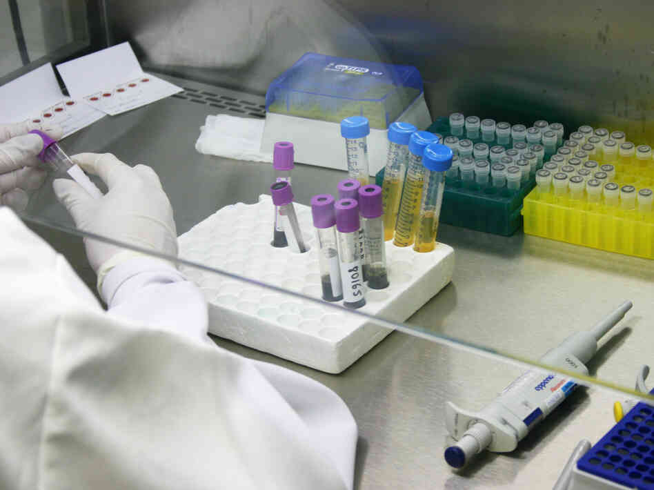 Researchers with HIV medication at a public research lab at the Oswaldo Cruz Foundation, or Fiocruz, in Rio de Janeiro.