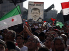 Demonstrators chant slogans supporting Egyptian President Mohammed Morsi during a rally in Tahrir Square in Cairo on Friday. Demonstrators chant slogans supporting Egyptian President Mohammed Morsi during a rally in Tahrir Square in Cairo on Friday.