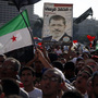 Demonstrators chant slogans supporting Egyptian President Mohammed Morsi during a rally in Tahrir Square in Cairo on Friday. Demonstrators chant slogans supporting Egyptian President Mohammed Morsi during a rally in Tahrir Square in Cairo on Friday.