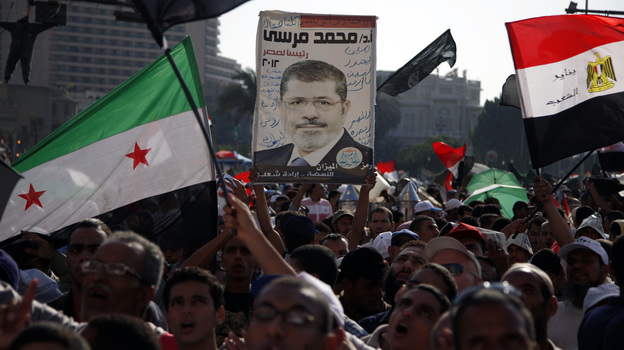 Demonstrators chant slogans supporting Egyptian President Mohammed Morsi during a rally in Tahrir Square in Cairo on Friday.