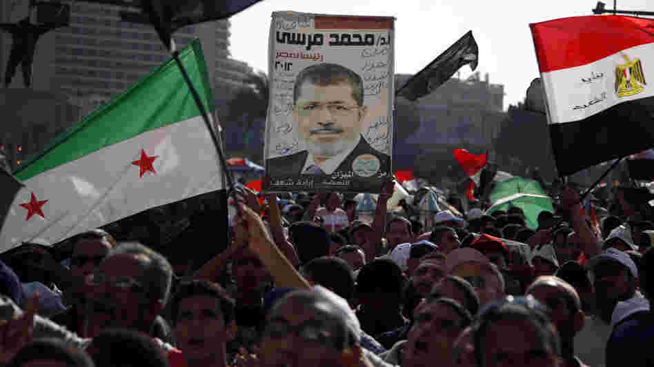 Demonstrators chant slogans supporting Egyptian President Mohammed Morsi during a rally in Tahrir Square in Cairo on Friday.