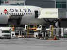 A Delta Air Lines jet being serviced last year by Gate Gourmet caterers in San Francisco. A Delta Air Lines jet being serviced last year by Gate Gourmet caterers in San Francisco.