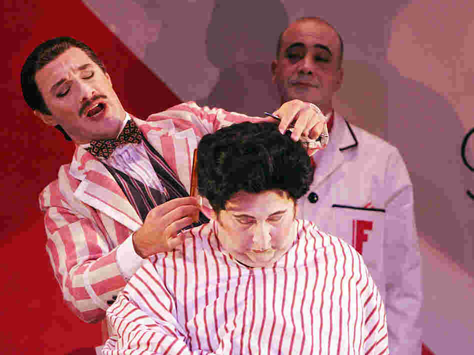 Jose Carbo (left) is the wily title character in a Sydney Opera House production of Rossini's Il barbieri di Siviglia.
