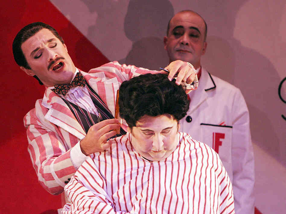 Jose Carbo (left) is the wily title character in a Sydney Opera House production of Rossini's Il barbieri di Siviglia.