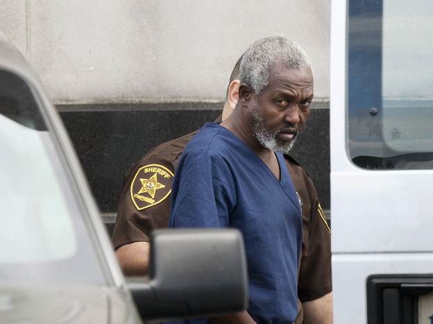 Mohammad Saaili Shibin, a Somali man accused of acting as chief negotiator for pirates who killed four American hostages, is transported from the U.S. District Court in Norfolk, Va., after a hearing on April 13, 2011.