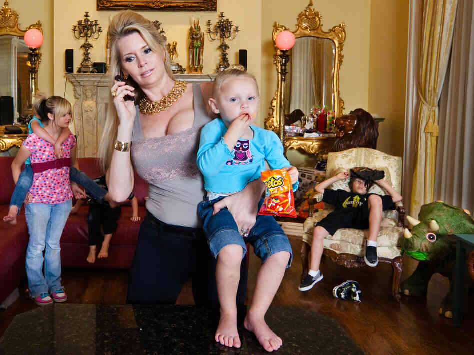 Jackie with five of her eight children. Thirty years younger than David, Jackie proves to be more than a typical trophy wife in the film.