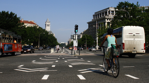 A cyclist rides in the the bike lane on Pennsylvania Avenue NW in Washington, D.C.