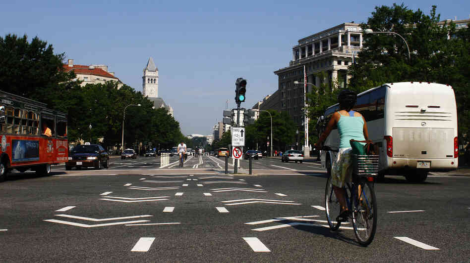 A cyclist rides in the the bike lane on Pennsylvania Avenue NW in Washington, D.C.