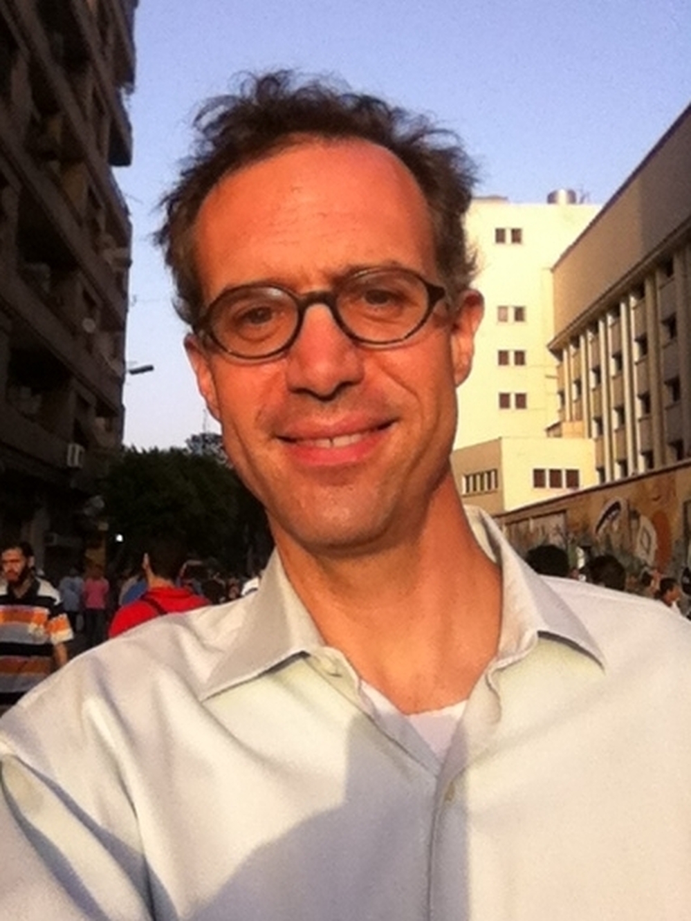 New York Times reporter David Kirkpatrick standing in Cairo's Tahrir Square.