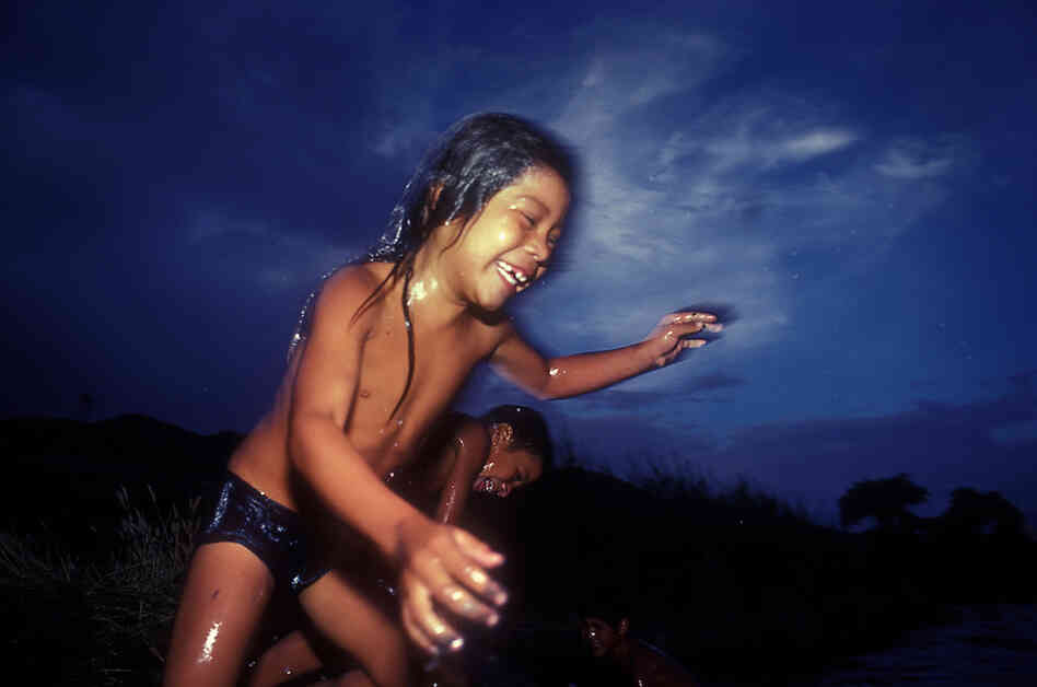 River Jump in the River with Two Names, 1989. Kids cool off in the river with two names — Rio Grande on the U.S. side, and Rio Bravo in Mexico.