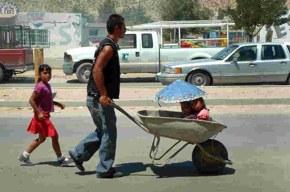 A man and his family in northeast Juarez, 2008