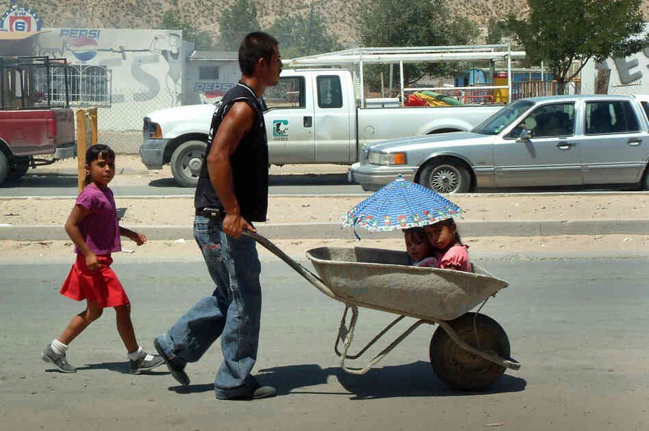A man and his family in northeast Juarez, 2008