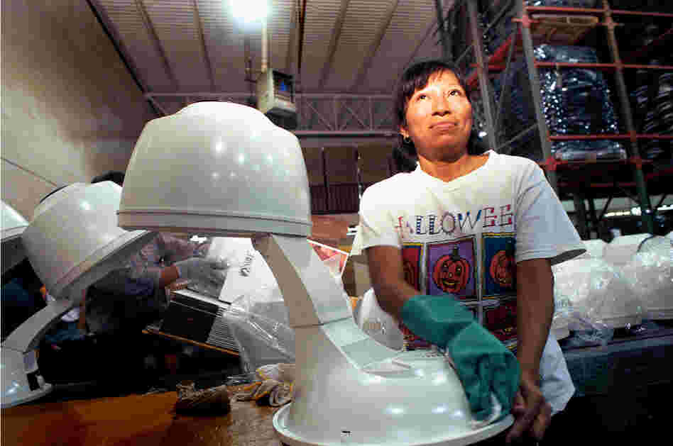 Woman in an assembly plant in Juarez (known as a maquila), 1999.
