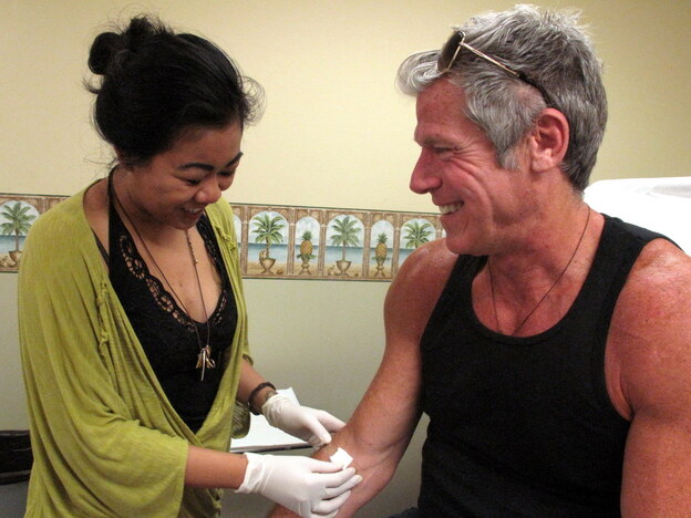 Nurse Priscila-Grace Gonzaga with Gregg Cassin, a San Francisco gay man who has been infected with HIV since the early 1980s. He's a volunteer in a cutting-edge gene therapy experiment to see whether HIV-infected people can be given an immune system that is invulnerable to HIV infection.