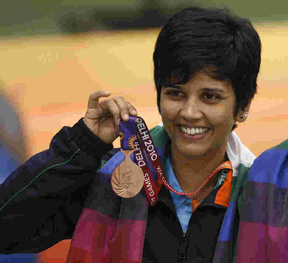 India's Suma Shirur won bronze in women's 10m air rifle pairs at the 2010 Commonwealth Games in New Delhi. She says her part-time government job gave her the time and financial stability to train for the 2004 Olympics in Athens.