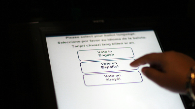 A Florida election official tests the accuracy of a voting machine on Aug. 4, 2010, in Miami.