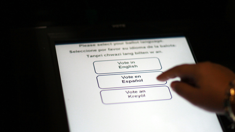 A Florida election official tests the accuracy of a voting machine on Aug. 4, 2010, in Miami.