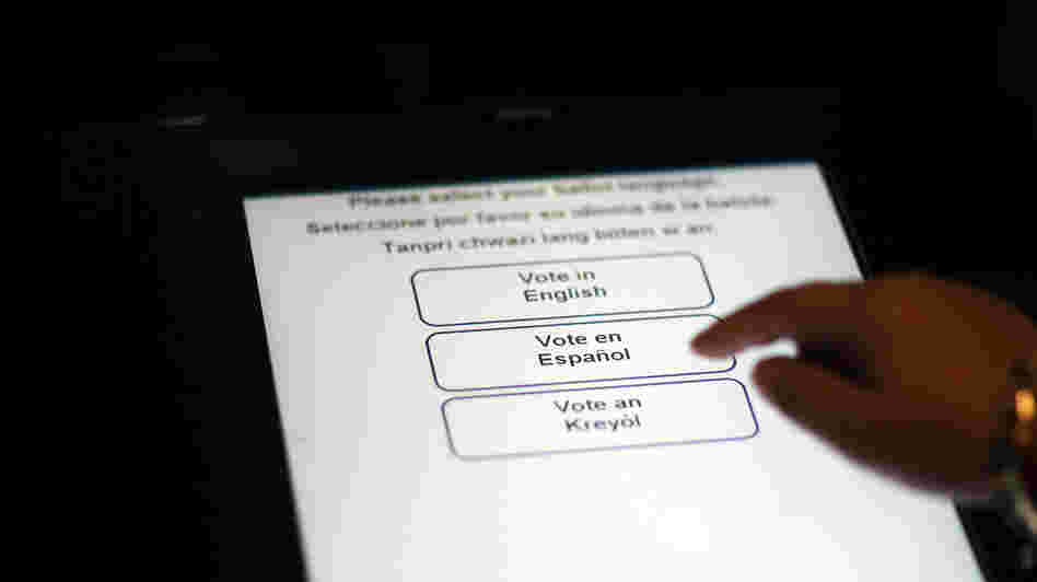 A Florida election official tests the accuracy of a voting machine on Aug. 4, 2010, in Miami.