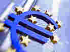 Monument to headier times: The euro logo outside the European Central Bank in Frankfurt. The International Monetary Fund has warned of possible deflation in parts of Europe.