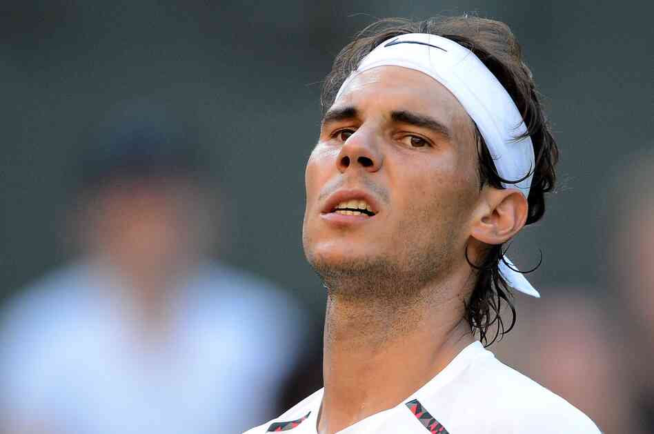 Spain's Rafael Nadal looks on during his Wimbledon loss to Czech Republic's Lukas Rosol in June.