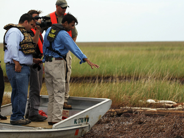 Louisiana Gov. Bobby Jindal checks out damage off Grand Isle, La., from the Deepwater Horizon oil spill in June 2010.