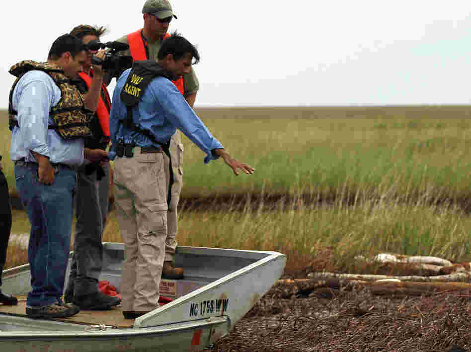 Louisiana Gov. Bobby Jindal checks out damage off Grand Isle, La., from the Deepwater Horizon oil spill in June 2010.