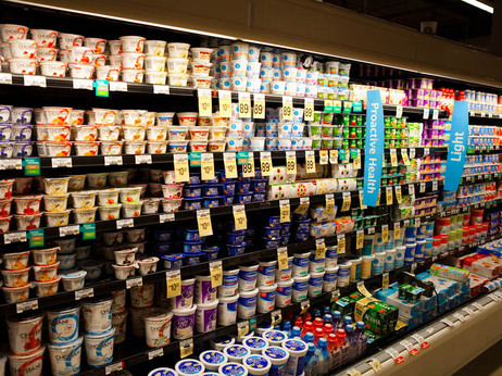 A supermarket's dairy case with shelves of yogurt A supermarket's dairy case with shelves of yogurt